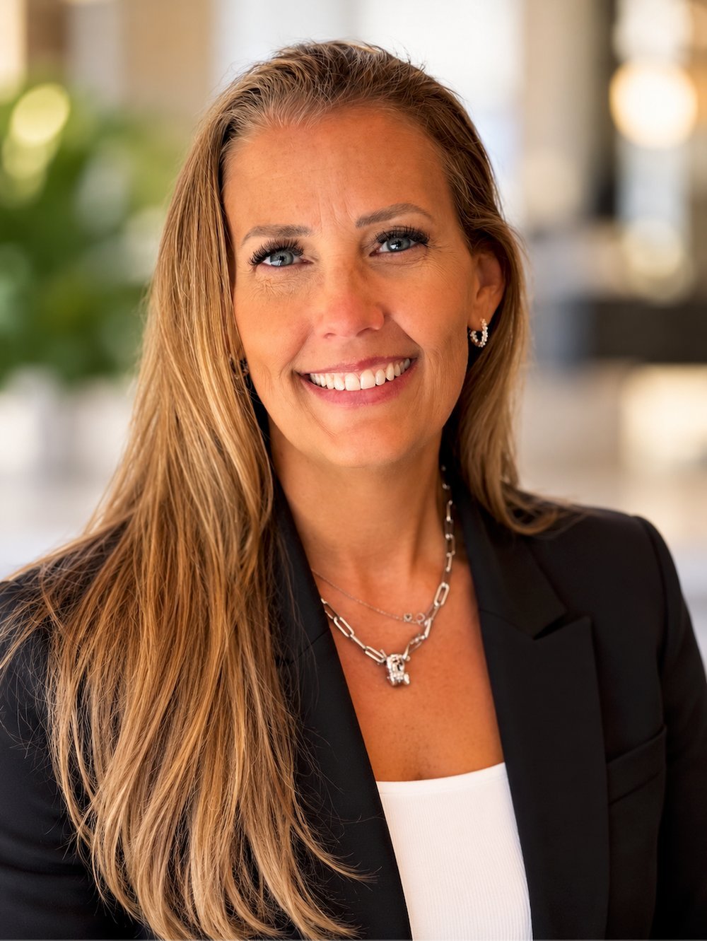 Sarah Franks, Travel Advisor, smiling in a black blazer